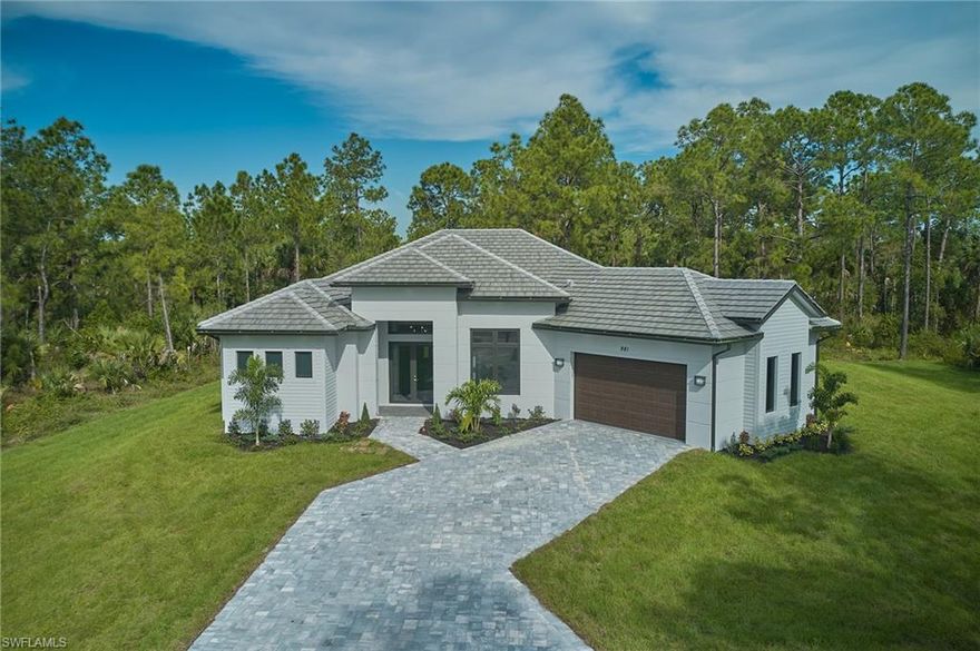 A DREAM HOME that is approx. 2300 + SF under air, with 3 bedrooms + office, 3 bathroom , 2 car garage. All porcelain tile floor inside and exterior, tile continues into the bathrooms showers and bathtub. Custom Wood cabinets, granite countertop and wall backsplash that is accompanied with stainless steel appliances in the kitchen. You will find crown molding in the living area and master bedroom. In the outside of the home you will find an asphalt driveway all the way up to the garage with tile roof, gutters all around the home with a sprinkler around and ALL IMPACT doors and windows are standard. Excellent Location just minutes from the new Publix shopping center and the schools of the area, best of all NO HOA FEES!!