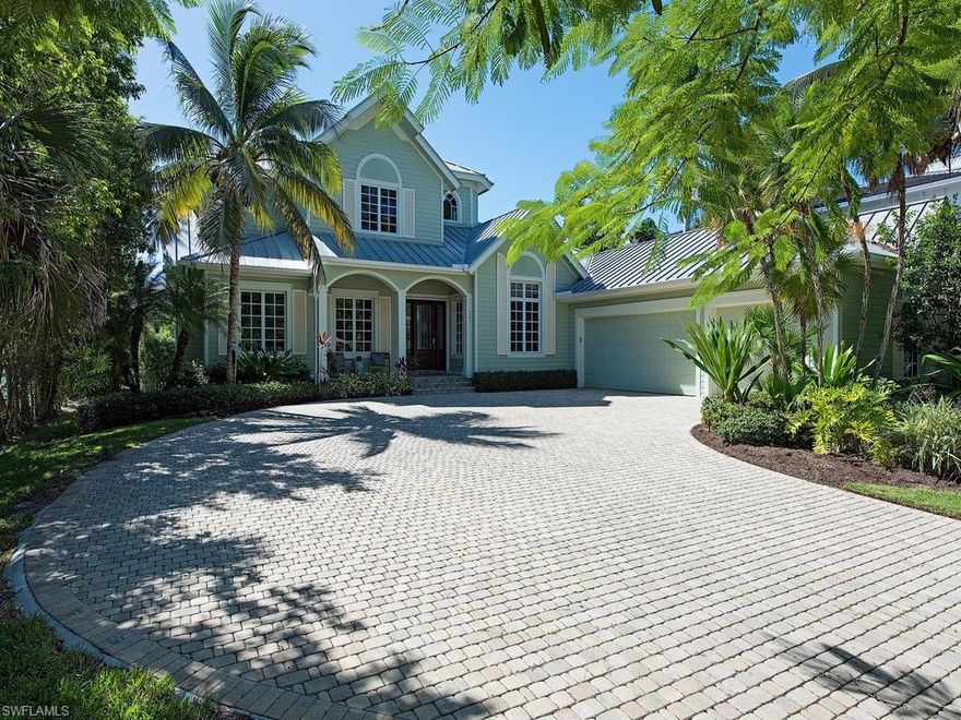 A quintessential Old Florida cottage just steps away from the beautiful sandy beaches of Old Naples, this is a really fun beach house!  Natural light makes the first floor bright and airy with wood floors, high ceilings and sliding doors which create an easy flow of indoor/outdoor living.  The first floor master suite provides access to the lanai and is a wonderful owner’s retreat.  All of the coastal contemporary living spaces surround the open kitchen which features white cabinets and granite countertops.  Upstairs, there is a comfortable guest lounge for media enjoyment, an outdoor terrace and the third and fourth bedrooms.  While enjoying southern exposure sunshine, the screened-lanai provides added resistance from the elements & makes the perfect setting for the pool & spa.  In this location, the 3-car garage is a great benefit as it provides extra room for beach toys, bikes or even a golf cart.  Walking to watch a famous Naples sunset is an experience that is tough to duplicate!  You may also enjoy sunset from the Naples Beach Hotel beachfront restaurant which is right around the corner and is also home to a world class golf course and a luxurious spa.