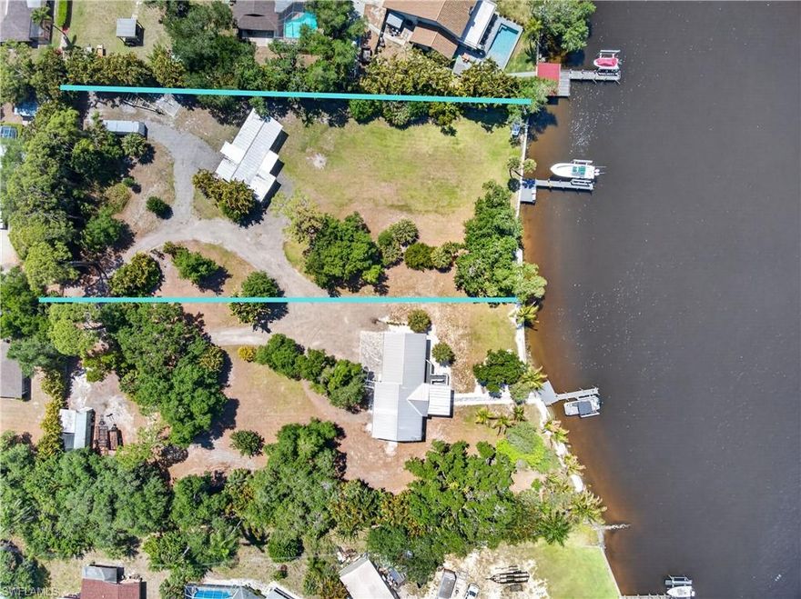 Calling all boaters! This is a rare opportunity to own just under 1 acre on the Caloosahatchee River, already equipped and ready for your vision.

The property features a brand-new seawall and dock (installed in 2022), offering immediate access to the water and effortless boating to the Gulf. Enjoy fishing, jet skiing, and true waterfront living right from your backyard.

Even better, the adjacent parcel is also for sale/available for purchase and comes equipped with its own dock and boat lift, both each have electric and water, all supported by durable concrete pilings. With one dock on each parcel and a total of two boat lifts between them 10K Lbs & 14K lbs, you’ll have exceptional flexibility for multiple vessels. Combine both parcels to create nearly 3 acres of prime riverfront property.

The main structure on this parcel has a very functional living space with a full kitchen, living area, 3 bedrooms, and 2 bathrooms....perfect as a rental, guest space, or while you build your dream home.

The property is fully fenced and offers privacy with a gated entrance, creating a secure and secluded waterfront retreat. With stunning north-facing river views, this is the perfect canvas to build, expand, or simply enjoy as-is.

An exceptional opportunity to own a nearly 3-acre riverfront compound: dual parcels, dock and lifts already in place, and a separate guest or fishing house; offering tremendous upside for redevelopment or the creation of an expansive private waterfront estate. More Photos coming soon!!