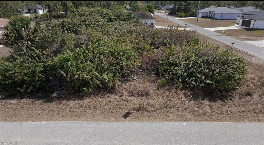 Are you ready to build your dream home? This lot has a lot to offer and is located in a growing area of Lehigh Acres with paved road access. Enjoy convenient access to schools, shopping, dining, and major roadways, while still being within driving distance of Fort Myers and surrounding areas. A great opportunity to build now or invest for the future in Southwest Florida.