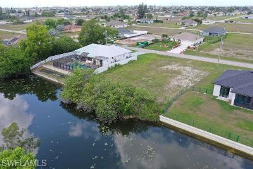 Build your dream home on this gorgeous Eastern exposure fresh water lot located on Verona Canal.  Verona Canal connects to several other canals including Arrowhead Lake for your boating pleasure.  This lot is mostly cleared.   This property is NOT located in a Flood Zone.   It is located in Zone X.    Quiet and private residential area.   Close to restaurants, shopping & schools.  This area does NOT have any water or assessments as they haven't even been scheduled.