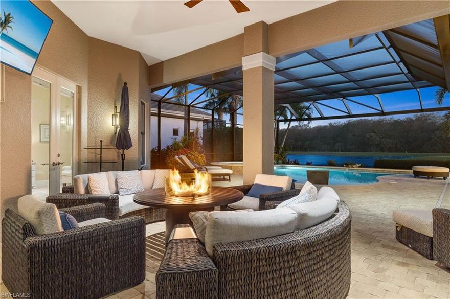 IMMEDIATE GOLF AVAILABLE!  Welcome to this exceptional custom-built estate home, boasting over 4,000 sq. ft. of living space. Southern lot with spectacular element of privacy and breathtaking views of the lake, golf course, and preserve. This magnificent residence features an open floor plan complete with 4 bedrooms, a den, and 5 baths. The heart of the home is the gourmet kitchen with professional series appliances, ideal for hosting special gatherings, while the adjoining dining room boasts a full wet bar and butler’s pantry. The expansive private outdoor area is ideal for entertaining complete with a full kitchen, wet bar and two separate seating and dining areas. Take a dip in the sparkling pool or unwind in the soothing spa, creating the perfect ambiance for relaxation and rejuvenation. 500 gallon underground gas tank powers the Spa, range, pool, & fire pit. TwinEagles is one of the finest communities in SWFL, experience 1,115 acres of natural tranquility, 2 Championship Golf Courses- Talon course designed by the Nicklaus Group and The Eagle Course designed by Steve Smyers. New Clubhouse, bocce Courts, Himalayan putting green, Fitness Center, Tennis, resort pool and tiki bar.