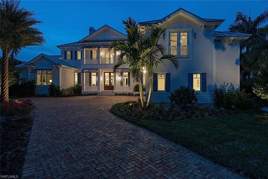 Sea Spray Cottage. Steps to the beach. Seconds to the Gulf. A truly breathtaking waterfront retreat has arrived in the Moorings. Boasting 164' of waterfrontage on Compass Cove with ideal sunset western exposure views, only the finest artisans have been assembled to deliver this enchanting and uncompromising Old Florida Cottage style home in a poetic aqua setting. Designed to showcase the sensational sight lines from virtually every vantage point, the open floor plan and soaring ceilings will provide coveted relaxation and true vacation living. Masterfully finished by Robb & Stucky to complement the cool lifestyle, take in the morning sky and sea from your 1st floor master suite, which is complemented with separate his and her oversized closets. The outdoor living area is where true bliss is realized with an oversized pool and spa that seem to flow directly into the cove beyond. Boater's will love the brand new sea wall, dock and boat lift made for the casual or serious sportsman. Also includes exclusive access and walking distance to the Moorings private beach park. One of the finest luxury waterfront estates ever to be built in the Moorings is now here...