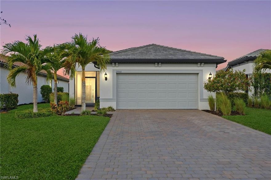 This Hallmark home with peaceful nature views is move-in ready and beautifully upgraded for effortless Southwest Florida living. Inside, you’ll find stainless gas appliances, quartz countertops, a stylish kitchen backsplash, and tile flooring throughout the main living areas. Plantation shutters add a clean, elevated finish throughout the home, and the den provides the perfect flex space for a home office, media room, or hobby space.

Open up the pocket sliding doors to the lanai and enjoy indoor-outdoor living year-round. You’ll also love the screened-in front porch, a welcoming spot for morning coffee and evening unwind time. The garage includes an extra 4-foot extension for added storage and functionality, plus epoxy flooring for a polished, finished look.

Inside the gates, you’ll enjoy vacation-inspired amenities designed for both relaxation and connection, from a stunning resort-style pool and spa to welcoming social spaces and on-site dining that make it easy to meet friends, unwind, and stay in the moment.

For an active lifestyle, the community also offers an impressive wellness and sports experience with plenty of ways to move, play, and stay consistent, along with outdoor recreation and everyday conveniences. Located in Estero,  a premier Southwest Florida location with quick access to beaches, dining, shopping, the airport, and more. Verdana Village delivers a lifestyle that makes every day feel like a getaway.