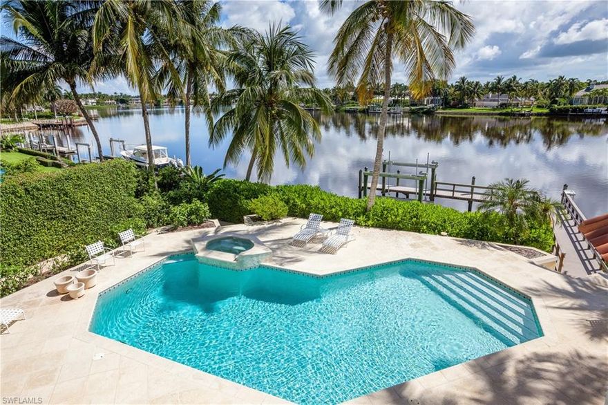 H.12042 Enjoy breathtaking views of Treasure Cove from this architectural masterpiece designed by renowned architect Kasimir Korybut.  The quality workmanship of A Vernon Allen Builder, Inc. ensures that no detail was overlooked. Recently updated kitchen features huge island, breakfast bar and gas stove.  Home is an entertainer’s dream with glass enclosed bonus room overlooking an over-sized pool complete with boat dock and boat lift. Second floor master retreat boasts water views, large walk-in closet, gorgeous shower with multiple shower heads and soaking tub.  Other recent improvements include roof, dock, impact doors and impact windows! Panoramic water views and comfortable living come together in this elegant residence complete with Port Royal Club membership eligibility!