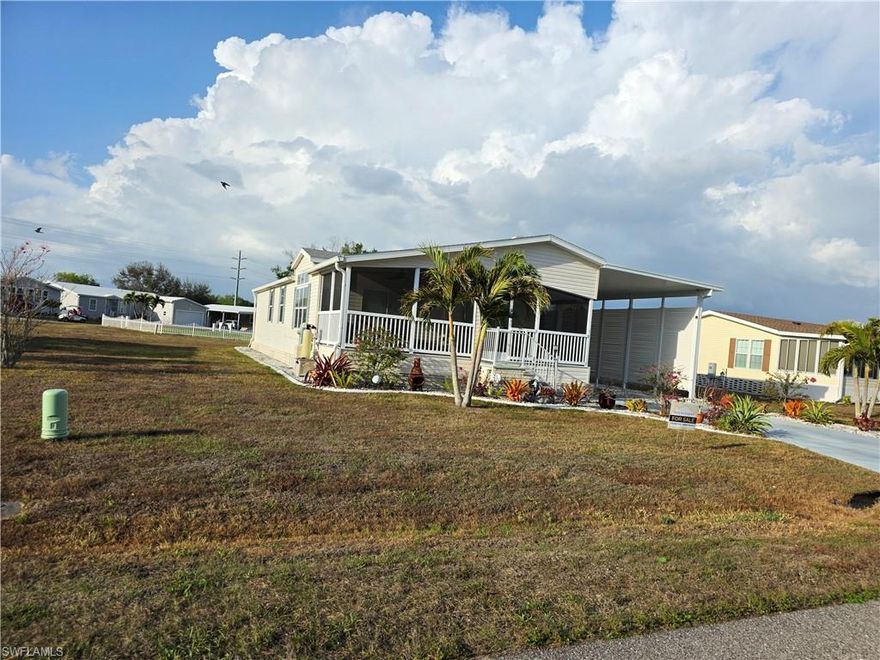 Spacious and well-maintained newer manufactured home built in 2012, situated on a large lot where you own the land, with a new roof installed in 2022. This beautiful home offers almost 1,600 sq. ft. of living space featuring 2 bedrooms, 2 bathrooms, and a versatile den/office with a built-in desk and Murphy bed, perfect for working from home or accommodating guests.

The home includes a large master bedroom with an ensuite master bathroom, providing a comfortable private retreat. Enjoy the convenience of indoor laundry and an open layout designed for easy living.

The spacious kitchen with a center island overlooks the large living room, which opens out to a generous screened-in front porch, perfect for relaxing and enjoying Florida living.

Also attached is an approximately 900 sq. ft. RV parking space with an attached storage room, offering plenty of room for your RV, toys, or extra storage.

Located in Country Lakes, a 55+ community, this home is just minutes from I-75 and Luckett Rd.