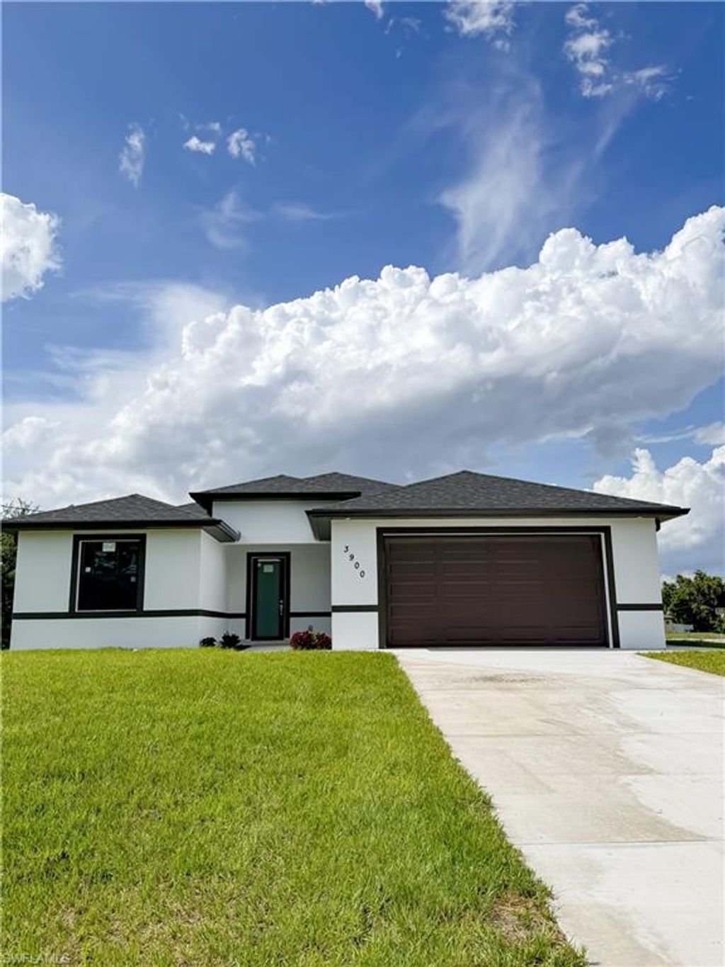 Photo of 3900 25th ST SW, LEHIGH ACRES, FL 33976 (MLS # 226020809)