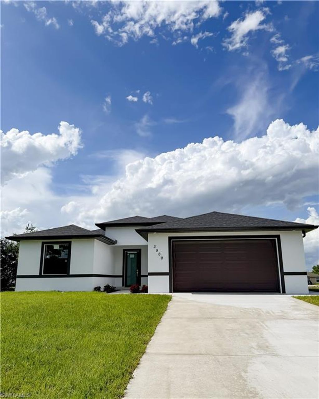 Photo of 3900 25th ST SW, LEHIGH ACRES, FL 33976 (MLS # 226020809)