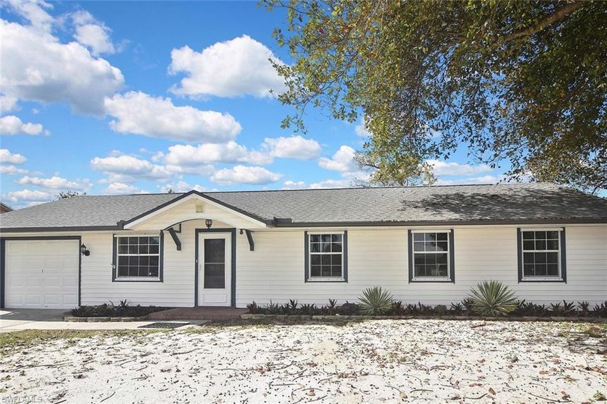 Beautifully updated 3-bedroom, 1.5-bath home featuring major recent upgrades including a brand-new septic system (2026), new HVAC system (2025), roof (2022), and newer water heater. The interior has been completely renovated with fresh paint inside and out, crown moulding, and no carpet throughout—featuring luxury vinyl plank and tile flooring. The open kitchen showcases a breakfast bar layout with custom concrete countertops, along with stainless steel appliances including a new dishwasher (2026), new disposal (2026), and refrigerator. Enjoy outdoor living in the spacious backyard with a large deck and patio area—perfect for entertaining, cookouts, and gatherings. The yard also includes a storage shed and offers plenty of room for a pool. Additional features include a one-car attached garage, and the home also includes a washer and dryer. The layout provides a great opportunity for buyers to personalize and make it their own. Ideally located in a growing Naples area, convenient to parks, community and sports centers, as well as shopping, dining, banks, grocery stores, and more.