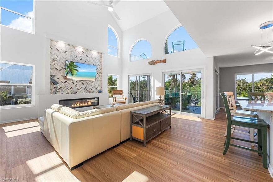 Welcome to 241 Violet Drive, a beautifully reimagined coastal retreat on Sanibel Island offering the perfect blend of modern upgrades, serene lake views, and effortless beachside living. Fully remodeled with a brand-new roof, new siding, new flooring, and all new hurricane-rated, sun-tinted windows, sliders, and doors, this home has been thoughtfully updated for comfort, resilience, and style.
Perfectly positioned on a peaceful lake, the home enjoys tranquil water views from nearly every room and is just a short walk to the beach with deeded beach access: a rare and valuable advantage on Sanibel. Natural light fills the open-concept living and dining area, where expansive windows frame the water, and a brand-new marble fireplace adds a touch of modern elegance.
One of the standout features of the home is the temperature-controlled enclosed living area, which opens directly onto the expansive outdoor living space. This flexible room extends your everyday living area, offering year-round comfort while maintaining a strong connection to the outdoors: perfect for morning coffee, reading, entertaining, or simply enjoying the lake breeze.
The layout offers 3 bedrooms and 2.5 baths, including an elevated primary suite designed as a private sanctuary. The primary bedroom features a private balcony overlooking the lake, offering a peaceful escape with unmatched views. Two additional bedrooms are thoughtfully separated for privacy, with one featuring its own screened-in balcony. A second, larger screened-in balcony extends from the main living area, allowing for effortless indoor–outdoor living.
This property belongs to Long Acre Lake HOA, which grants residents access to the highly desirable Seagull Estates amenities, including a community clubhouse, tennis courts, pickleball courts, and a community pool, enhancing the already exceptional lifestyle offered by this location.
Beautifully renovated and ideally situated between calm lake waters and pristine Gulf beaches, 241 Violet Drive embodies the quintessential Sanibel lifestyle: bright, tranquil, coastal, and connected to nature.