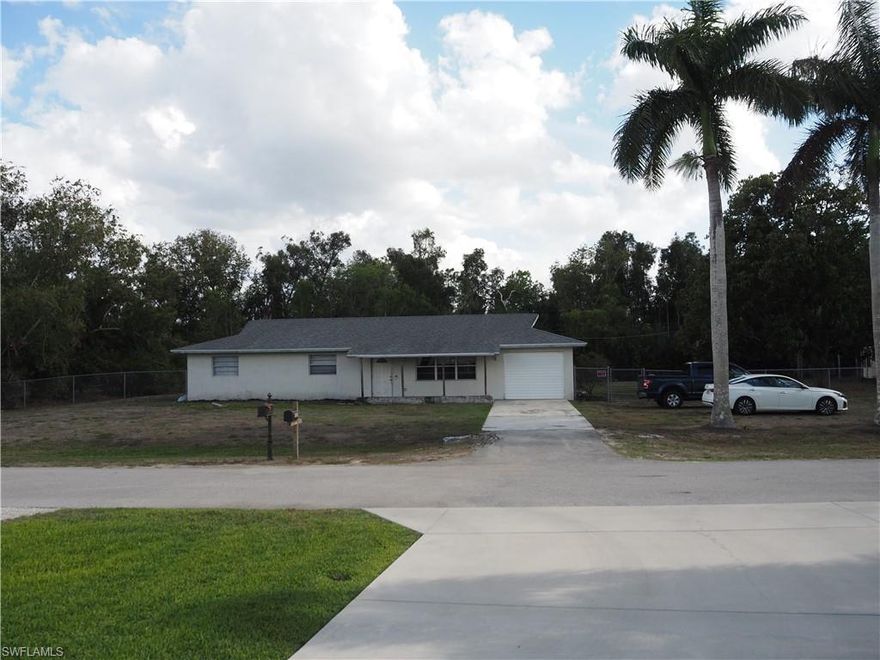 A HOUSE IN BONITA SPRINGS ON AN ACRE UNDER $450K IS HERE NOW! MAKE OFFERS ASAP, THIS WILL NOT LAST.
ENTER, WALK IN AND MAKE IT YOUR OWN, REMODEL OR RENOVATE. THIS COULD ALSO BE AN INVESTORS OPPORTUNITY! THIS RARE, QUIET, SIDE ROAD WITH A FENCED IN 1 ACRE LOT IS A SINGLE-FAMILY-HOME IN A NO FLOOD, AGRICULTURE ZONED AREA, WITH NO HOA FEES AND JUST MINUTES TO THE THRIVING NEW DEVELOPMENTS OFF PARADISE ROAD AND DOWNTOWN BONITA SPRINGS. 
PLUS, YOU ARE ABOUT 20 MINUTES TO THE BEACH! The choice is yours; move into this BLANK CANVAS, rent, choose to AirBNB (no rental restrictions), expand/renovate, or re-build new the options are endless! 
The home is already a 3-bed, 2-bath, 1-story home. The ROOF & A/C are Newer. 
This RARE 1-ACRE LOT offers opportunities for privacy, entertainment and plenty of room for your pets to run. Plus, you're just minutes away from hopping downtown Bonita Springs with new local restaurants, cafes & shops and Riverside Park; live festivals, concerts and family fun, a new library, live music at Sugarshack Downtown, Grumpy Goat Coffee Roaster, Chubby Mermaid Brewery and historic attractions such as Shangri-La Springs & Wonder Gardens. Don't miss out on this Exciting Opportunity!