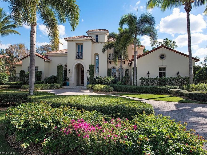 NEWLY FURNISHED AND REFINISHED. This opulent two story estate boasts all of the amenities you would expect from a home of this magnitude. You are instantly captivated by the abundance of architectural appointments and attention to detail including the volume ceilings highlighted by tray and barrel design elements, crown molding and exposed beam accents. Other features include arched passageways and thresholds, extensive windows, gorgeous granite countertops, and carpet, handsome wood and natural stone flooring. Luxurious amenities include a private elevator, wine cellar, butler’s pantry, media/game room complete with a wet bar and theater, a covered outdoor summer kitchen as well as a guest suite boasting private entry. Enjoy tropical outdoor living soaking up the Florida sunshine in the open air outdoor living spaces surround the custom pool and spill over spa with south eastern sparkling lake and sweeping golf course views beyond.