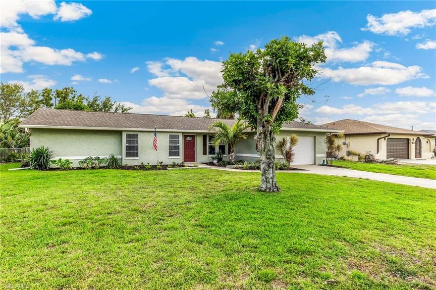 This 2 bed/2 bath beautifully updated home is ready for family fun!  HUGE fenced-in backyard has plenty of room for a pool and BBQ with family and friends AND has 2 avocado, 1 banana, and 1 mango tree for the freshest fruit   right in your own backyard!  Enjoy the outdoors from the screened-in porch or keep cool inside and savor the view from the cheery Florida room.  Head to the den/flex room to watch YOUR TV faves, read, or perhaps get some homework done. It's another gathering space by your beautiful kitchen with updated granite countertops and Whirlpool/Amana appliances. And finally, for those of us that have a wardrobe and shoes, prepare to be AMAZED at the huge primary closet!  Love at first sight!  New roof 2/2023, Replumbed 3/2021, Chain link fence 9/2020  Plus this home is close (approx. 1.5mi) to Cape Coral Hospital and Caloosa Elementary/Middle schools.  You're right- this one won't last!!