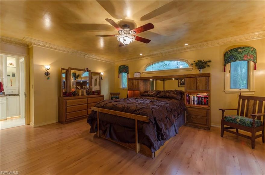 SELLER SAYS "SELL"!!!  Bring an offer!  This private paradise provides tranquility, yet is only minutes from dining and shopping options, golf courses, SW FL International Airport, Gulf Coast University and the Gulf of Mexico beaches.  A long shaded driveway leads to this unique home with a screened in pool and plenty of room for entertaining.  The cute & cozy guest house quarters are in a separate dwelling on the 2nd level w/a 2 stall garage underneath.  There is a reverse osmosis system and 10,000 watts of solar panels to provide electrical savings!.  On sunny days, the solar powers the whole house!  Think how much money ($$$)you'll save!.  Nearly 2 acres of land -- imagine what you can do with that much land and still be so close to everything!