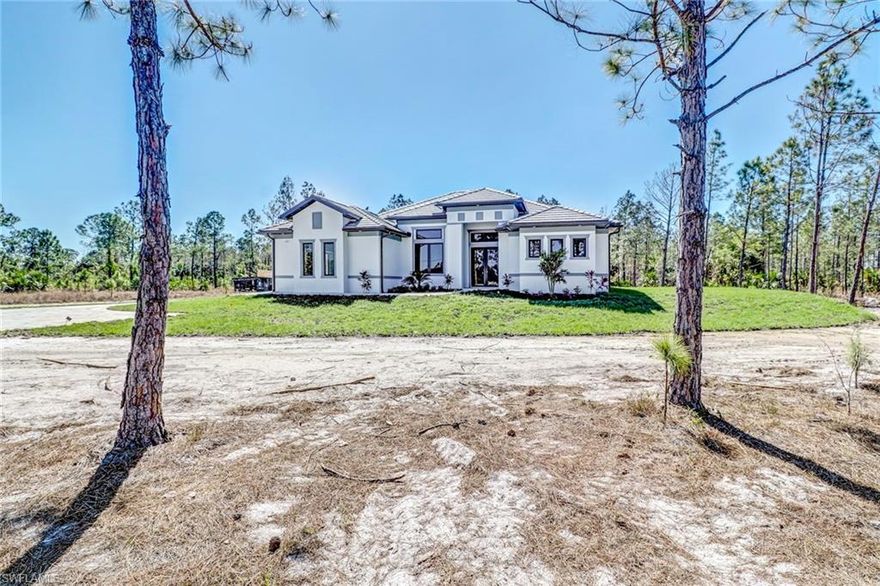 HOME UNDER CONSTRUCTION!! PICTURES ARE SIMILIAR TO A MODEL HOME LOCATED AT 257 17TH ST NW Exquisite Home!! Brand New Construction, Located minutes from the new Publix. Beautiful street with elegant neighboring homes! This home offers 2.50 acres of lush property that gives you plenty of space to build a pool for the summertime coming! Best of all, NO HOA fees! Looking for a home in a GREAT LOCATION, with a GREAT SCHOOL ZONE, lots of ACREAGE, and under 10 minutes away from shops and dining, then you have found your match!! Hurry and call now to see this beauty!! There is still time to pick your colors, cabinetry, and QUARTZ but only if you hurry now!!! This home is loaded with special features & upgrades which includes a PAVED DRIVEWAY, TILE ROOF, OUTDOOR SUMMER KITCHEN, SPRINKLER SYSTEM, STAINLESS STEEL APPLIANCES, TILE THROUGHOUT, GUTTERS, & IMPACT DOORS & WINDOWS to ensure your safety during hurricane season in SWFL!! You can get all this for an unbelievably low price!! And better yet home comes with 2-10 WARRANTY! THIS IS NOT THE ORDINARY BUILDER IN GOLDEN GATE ESTATES THIS IS QUALITY INVESTMENT!! Make this home yours today, don't wait any longer!