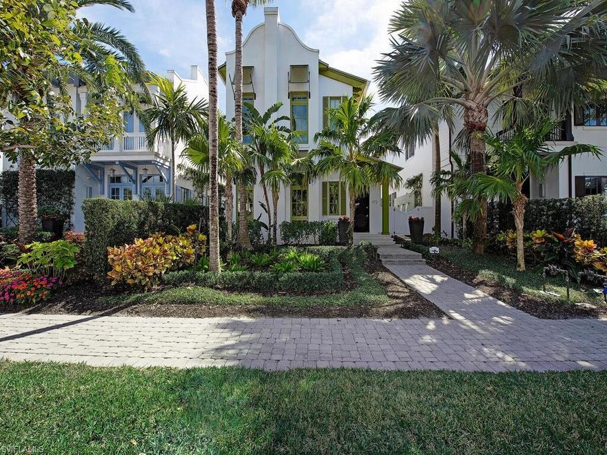 A strong competitor for superior value in the Olde Naples single-family market. Situated in the heart of Old Naples on one of its most charming streets, steps to Gulf beaches and the shops and restaurants on 5th Avenue South and 3rd Street South, and walkable to the Naples marina, this is a furnished, 2-story home built in 2014 that exudes casual elegance and is the epitome of Florida living. Designed by Jeff Harrell and Associates, this 3-bedroom plus den, 4.5-bath townhome features an open floor plan with soaring ceilings, floor-to-ceiling windows and an abundance of all-day natural light. Note the light oak, wide-plank floors; quartz counter-tops; modern ceiling fans and designer light fixtures throughout. The chef’s kitchen has superior appliances -  oven/cook-top (Viking), wine cooler (Uline), convection microwave (Miele), refrigerator freezer (Miele), and dishwasher (Miele). The huge center island serves as a dining destination, a preparation space or buffet serving station. Toward the front of the house, there is a first-floor guest suite tucked away for privacy. The lushly landscaped and very private lanai, accessible from the great room or the kitchen through multiple French doors, also features a covered and screened seating/dining area with gas fireplace and gas grill and a cabana bath. Around the sun drenched 32’ pool and spacious spa? Dramatic fire bowl and soothing waterfalls. This is the perfect spot for relaxing or entertaining, day or night. On the second floor, a spacious guest suite. In addition: The over-sized primary suite features dual, walk-in closets fitted for maximum functionality and a floating tub plus large separate shower. Over the garage and accessible from the main residence or by a separate entrance from the alleyway, a versatile space to use as a den/office/fitness center or guest cabana with refrigerator and private bath. Additional features: impact-rated windows and doors throughout; automated window coverings; 48-kw Kohler whole house generator; tankless hot water heater; two A/C units w/separate zones (one replaced in August 2024); an AC split in the oversized, 2-bay garage accessed from the alley; spacious laundry room with laundry sink and front-loading washer and dryer (Whirlpool Duet); new Jandy pool system July 2024. Note: this part of Naples is served by natural gas “in the ground”: the generator, water heater, pool heater, gas cooktop, outdoor grill, outdoor fireplace and fire bowl features are gas-powered.
