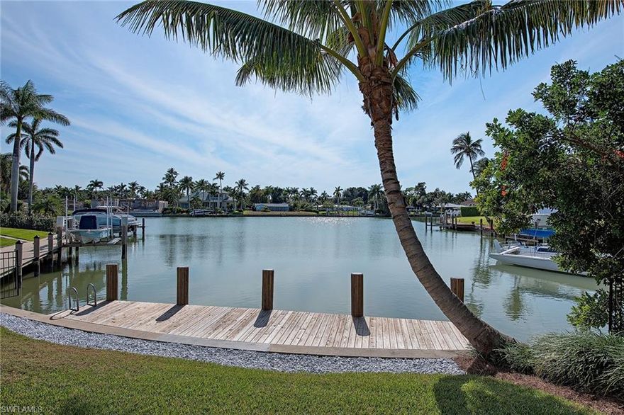 IT’S ALL ABOUT THE VIEW, LOCATION and the WOW! Enjoy long water views and sunset skies from the entry, great room, family room, kitchen, master suite and pool area. LOCATION - waterfront home located on one of the limited and most coveted sites with no bridges into the Gulf. This desired southwest exposure .43 acre corner lot is a short stroll to the private Moorings Property Owners Beach on the Gulf of Mexico. THE WOW! This award-winning home by architect Andrea Clark Brown was designed especially for the site with almost 3200 square feet of flowing design, vaulting ceilings, warm wood floors and French doors and disappearing sliders opening to the pool and screened lanai for formal as well as casual entertaining. Morning light is captured in the kitchen and breezes flow from the kitchen windows to the screened side entry doors. 35’ long pool, 3 car garage, three bedrooms plus den/fourth bedroom, three full baths plus one half bath, his and her master walk-in closets and abundant storage. Priced below recent appraisal. From the gated courtyard entry with 24’ walls open to the sky creating dramatic shadows to the sparkling water of Bowline Bay, this home is special.