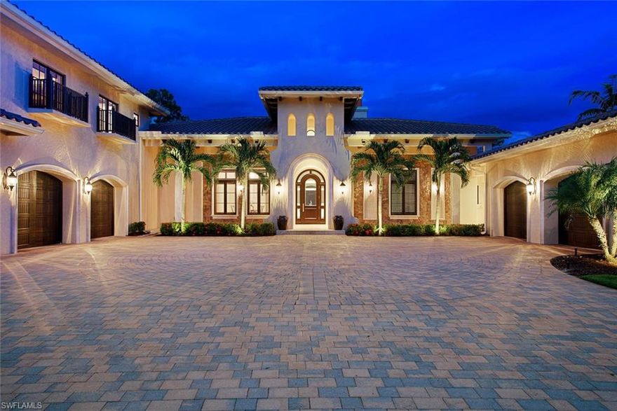 H.16023 - GOLF MEMBERSHIP SPOT INCLUDED!!  With its masterful, million-dollar modernization in 2019, professional design, this Verona residence is absolutely stunning! Captivating views of the sparkling infinity edge pool, spa, long lake & preserve through huge impact-glass windows & sliders, greet you upon entry. The right wing encompasses a ½ bath, ensuite guest bedroom & dedicated office before leading into the spacious & refined master suite. The master bath is jaw-droppingly beautiful with exquisite quartzite surfaces & luxurious fixtures - These quarters WILL deliver your serenity after a long day. Left of the grand foyer, opens with an enormous "chef's dream" kitchen featuring quartzite countertops, Wolf natural gas range & generous walk-in pantry. Formal dining area, large leisure space & nook allow for more than enough room to entertain family & friends. Three more ensuite guest rooms downstairs complete this wing. Upstairs, a spacious media room (also ensuite). Adding to the impressive list of features: two garages (5 car total,) Lutron lighting, hardwood, marble & travertine flooring.  An idyllic setting with lush, thoughtful landscaping to ensure max privacy.