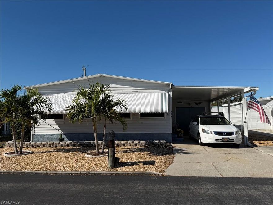 Very nice 2 BR/2 BA home, furnished move-in ready in Carriage Village.  Kitchen has custom wood cabinets and opens to Florida Room.  Dining area with built in hutch.  Roof 2021.  Replumbed 2024.  AC 2019.  Primary suite is spacious with vanity, shower, toilet area and closets.  Plenty of windows for natural light.  Oversized utility shed with Washer & Dryer which can be a workshop and extra storage.  Golf Cart Included.  Awnings around home for added sun and weather protection.  OWN YOUR LAND in this 55+ active, pet friendly community of Carriage Village.  Maintenance Fee is only $95/month.  Community has large, heated pool, clubhouse, library, billiards room, hobby shop, putting green, shuffleboard, bocce ball, ceramics, dances, dinners and more.  Start enjoying the Florida Lifestyle.