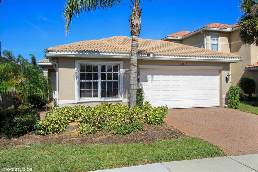Amazing opportunity in this beautifully upgraded 3 bedroom, 2 bath home in one of Ft. Myers most desirable neighborhoods.  This spacious home features Great Room, Family Dining, Screened & Covered Patio, 2-car Garage, and an expansive lake view. Wood flooring throughout except guest rooms, new carpet in guest rooms, 42 Wood Kitchen Cabinets, Granite countertops, Undermount sink, Solid Surface countertops complete this incredibly maintained home.   Botanica Lakes is a gorgeous gated community featuring over 105 acres of lakes and preserves and spectacular amenities. You'll love the fabulous Clubhouse and 7 acre recreation area featuring a fitness center, resort-style pool, tennis, basketball courts and much more.