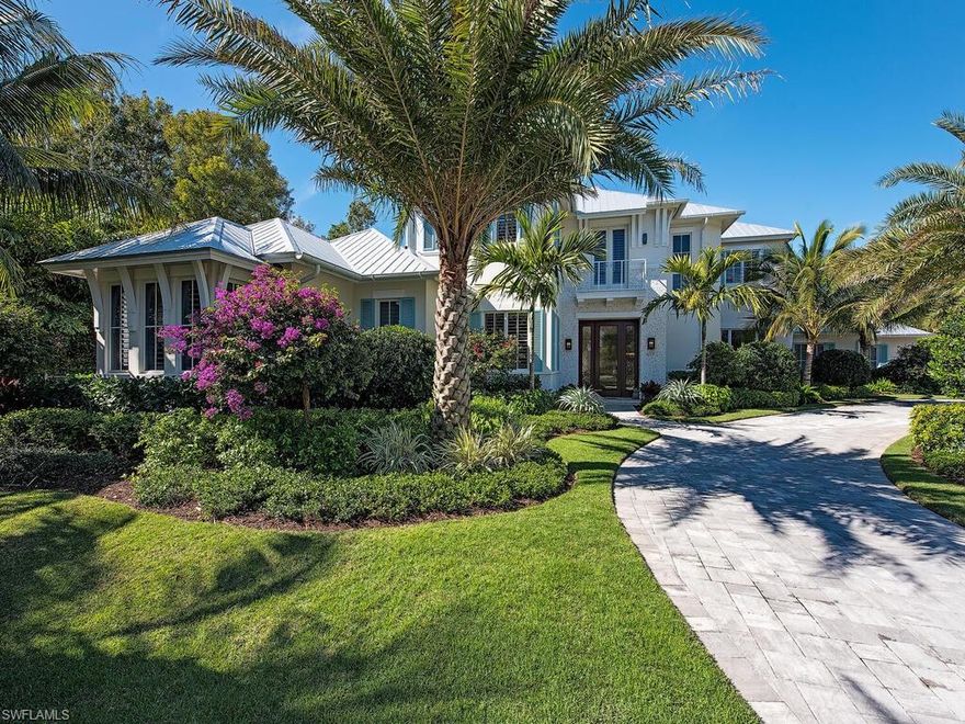 Perfectly situated on an oversized Southern exposure lot in the heart of Old Naples sits this beautiful coastal style home. Natural light illuminates the open floor plan while enjoying views of the pool and your magnificently landscaped private grounds. Upon entering you quickly notice the high level of quality and finishes. The recent owner has added an abundance of upgrades including a whole home generator, multiple wine fridges, plantation shutters throughout, water filtration system, Sliding glass doors, electric shutters, extensive landscape and irrigation, upgraded security system, and much more! Walking out the kitchen through your custom wood bi-folding doors you will appreciate ample outdoor living space equipped with a remastered outdoor kitchen and gas fireplace. Located on a very quiet street close to the white sandy beaches and 5th Ave S makes this a rare find in todays market!