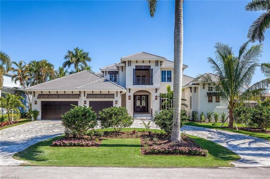 Beyond the quiet tree-lined ambiance of Aqualane Shores sits a beautiful new construction home with an expansive open floor plan, gourmet kitchen, butler's pantry, wine cellar, study, wet bar, private elevator and oversized three-car garage.  Residents and guests will enjoy the home's spacious first-floor master and en-suite guest bedroom. On the second floor, there are three en-suite bedrooms complete with a gathering room, wet bar, second-floor laundry room and large covered balcony with serene views of the water. The artfully designed expansive outdoor area is complete with a new seawall, grass pavers, fire pit, zero infinity pool with chaise lounge, fully stocked outdoor kitchen and a large covered area for dining and entertaining. All wrapped in lush private landscaping, this luxury home is ready for occupancy!