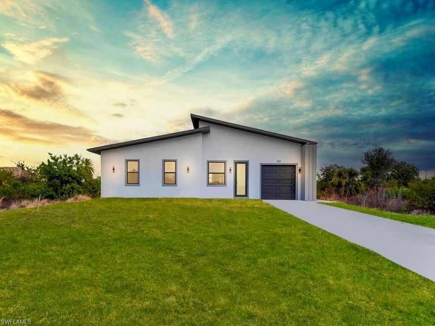 Welcome to this MAGNIFICENT MODERN 3/3 Nestled away on a quiet DEAD END cul-de-sac just minutes to all major amenities & a quick commute to Fort Myers. These GRAND elevations with high Volume ceilings & 8FT IMPACT windows & doors spotlights attractive OVERSIZED porcelain tile throughout, a welcoming breakfast bar with rainfall QUARTZ countertops, soft-close shaker cabinets, high end LG STAINLESS STEEL appliances, and IMPRESSIVE frame-less glass TILED showers. This open floor plan with GREAT room highlights Premium fixtures with remotes, Pendant & recessed lighting, walk-in closet & Desirable closet organizers, enticing QUARTZ countertops in baths, and an open back patio with Potential Pool bath or efficiency access. It also features a HIGH EFFICIENCY washer & dryer under air, epoxy flooring in garage, custom mirrors, entertainment pre-wired, nicely tiled front entrance and a walkway around to garage. Schedule your private showing today!