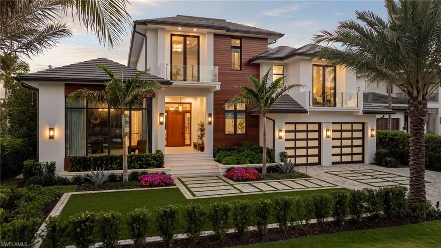 The only brand new construction being sold furnished on a south facing lot. Nothing better in Aqualane Shores! Experience this ultra-custom, ultra-luxurious home located in Aqualane Shores, one of Naples’ most prestigious neighborhoods. Every detail has
been envisioned & perfected by architect John Kukk and nationally renowned interior design firm Amy Storm & Company, & carefully constructed by Refined Builders. It is situated on a prime lot with southern exposure. No expense has been spared in crafting this coastal- inspired modern home, which features natural materials, layered neutrals & harmonious finishes, as well as thoughtful space planning. The heart of the home lies in the custom-designed kitchen, bar, & great room, showcasing hand-selected finishes, such as Aella Marble countertops & backsplash, La Cornue stove, top-of-the-line appliances & tasteful lighting. 5 generously-sized bedrooms w ensuite bathrooms are positioned on 2 levels, with an elevator ensuring easy access. Step outside & bask in the Florida sunshine. Welcome & entertain guests on the beautiful lanai with outdoor kitchen & plaster-clad fireplace. Relax by the pool & spa and enjoy the canal view, while surrounded by lush greenery. There is also direct access to the Gulf.