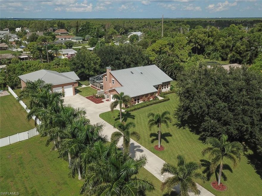 RV OWNERS / BOAT ENTHUSIASTS / CAR COLLECTORS / BUSINESS OWNERS WITH COVERED STORAGE NEEDS?? THIS PROPERTY IS THE PERFECT FIT!!  Two-story, 4 bdrms, 3 baths pool home, 2-car attached garage PLUS A DETACHED, 6-CAR GARAGE & WORKSHOP situated on 1.11 acres! PROPERTY BOASTS WHOLE HOUSE GENERATOR (2-1000 Gal propane tanks), WHOLE HOUSE REVERSE OSMOSIS SYSTEM, HURRICANE SHUTTERS, CENTRAL VAC SYSTEM, MANABLOC PLUMBING SYSTEM, WOOD-BURNING STONE FIREPLACE, DRY BAR W/WINE RACK & DUAL-ZONE COOLER, & SECURITY SYSTEM! MAINTENANCE-FREE, GAS HEATED POOL, BONAMITE DECK AND HOTSPRINGS CLASSIC SPA! Remodeling on 1st Floor - New Tile Plank Floors, Refinished Dutch Mills Cabinetry & New hardware, New Black Galaxy Granite Counter-tops, New Pendant & Cluster Light Fixtures, New SS Farmhouse Sink w/Dual Bowls & a Complete Renovation of the Guest Bathroom! Solid Oak staircase w/ solid oak treads & handrails. All Bedrms on 2nd floor - Engineered Birch floors, twin closets, ceiling fans/lights, custom window treatments and a glorious Western view. The picturesque front yard, paired with a tree-lined, fenced-in backyard makes for an impressive, peaceful and private home! Being sold Partially Furnished!