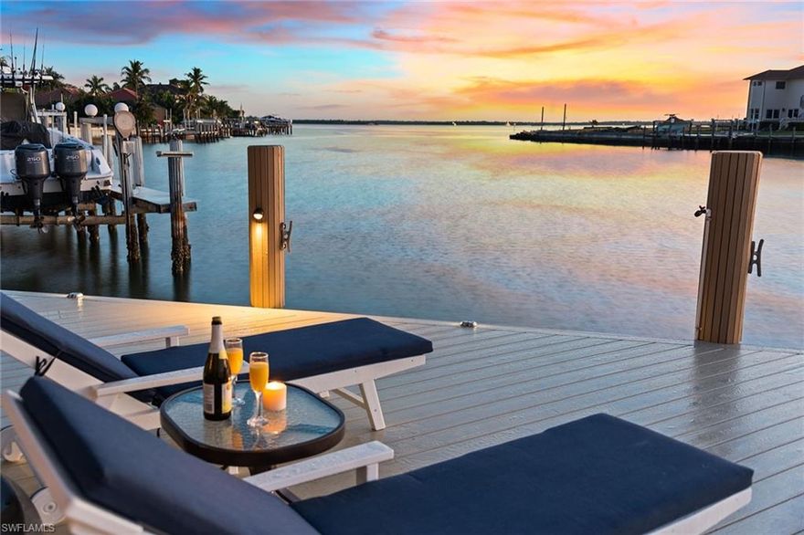 Imagine watching the sunrise each morning overlooking your bay view from your high-quality, custom-built luxury home with very quick direct boating access to the open water. Every inch of this 4 BR, 5 BA home with 3-car garage has been well-designed to take advantage of the spectacular water views from the moment you walk in the door and throughout the home. New AC units, new dock, new 24K generator. Exquisite details include an elevator, crown molding, tile floors (no carpet), storm protection, sound system, wine refrigerator, security, custom walk-in closets, tray ceilings and fenced-in backyard. The open floor plan allows for perfect indoor-outdoor entertaining. The impressive kitchen offers gas cooking, Thermador appliances, including a 6-burner range, solid wood cabinetry, granite, SS appliances and ice maker. The floor plan allows for privacy for all families and guests, including two master suites. The outdoor living is just as magnificent with a 900 SF floating dock with capacity for large boat and a motorized platform for your smaller boat or jetskis, gas-heated salt-water pool and spa with travertine deck and motorized screens. No detail has been overlooked.