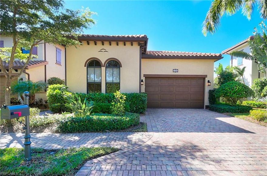 This beautifully appointed single-family home is located in the gated community of Cordoba at Lely Resort. Lush tropical landscaping, both front and back, and meticulously maintained inside with upgrades of nearly $100K makes this home perfect for someone appreciating the attention to detail. As you enter from your private courtyard, the soaring 12' trey ceilings with crown molding catches the eye. You'll want to linger in the dramatic living room while the neutral colors and luxurious look of tile flooring throughout, recessed lighting, and transom windows give it a contemporary feel. Prepare family feasts with ease in the generous kitchen featuring granite counters and backsplash and refined walnut cabinetry from Medallion, stainless appliances, and a breakfast bar. Open the triple slider with nesting doors that flow out to an expansive lanai. The outdoor oasis features a heated jetted pool and spacious patio with Sunsetter retractable awning. The master ensuite offers 2 vanities featuring granite counters, a walk-in shower, and custom walk-in closet. The guest bedroom offers a 3/4 bath ensuite with a pocket door providing lots of privacy.