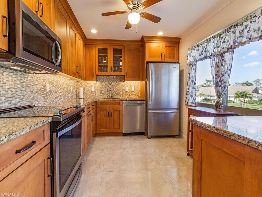 C9043 PRICE ADJUSTMENT! True value for the price. Come see this fully renovated unit! New A/C July 2023! Beautiful 2019 renovation in the heart of The Glades Golf and Country Club within walking distance to Clubhouse, Pro Shop and activities! This unit boasts a stunning kitchen remodel with extra cabinets and stainless-steel appliances; it is also opened up to the entry and living space to allow better communication with guests.  The ceilings were raised and there is beautiful crown molding. Both bathrooms are FULLY renovated.  Closet organizers keep things neat and tidy. All living space flooring is updated to easy-on-the-feet laminate. Kitchen, bathrooms, and lanai are tile.  Enjoy the serenity of the landscaped area from the screened lanai at the back.  Beautiful light abounds in this unit that is benefited by the extra window in the living area. Two different pools about 100 yards away! The Glades boasts two renovated golf courses - Par 70 and Par 55.  Other amenities include tennis, pickleball, bocce, shuffleboard, 9 community pools, and a host of other regularly scheduled activities. There is always something to do here! Make this property your Naples home!