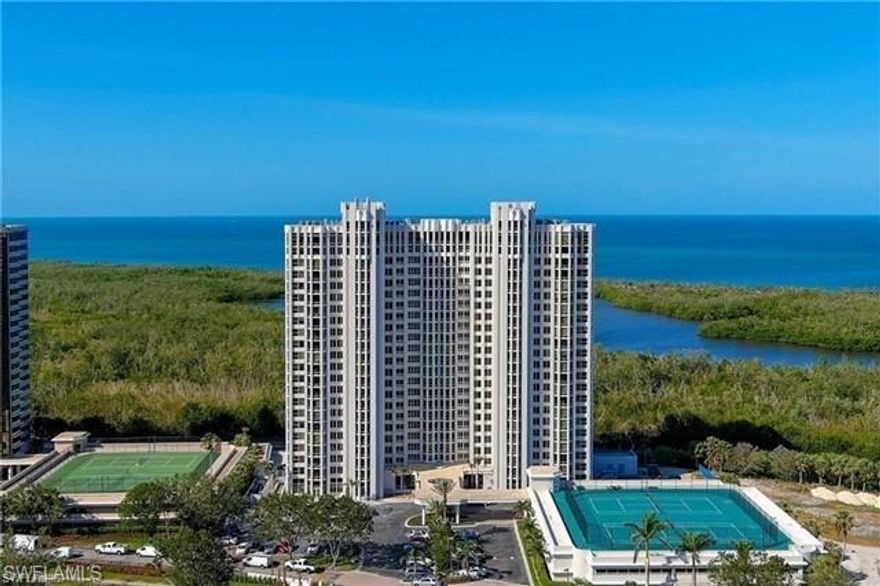 Embrace Sunsets & Sunrises in this 9th floor 3/2 Pelican Bay Paradise. Wake up to breathtaking Florida sunrises over the Pelican Bay Championship Golf Course, and conclude your day with mesmerizing Gulf of Mexico sunsets, all from the comfort of your bright and open condo. Step outside your door and onto the tram for a convenient ride down the boardwalk to pristine white-sand beaches and delectable restaurants. After a delightful dinner, take a leisurely stroll back along the boardwalk and immerse yourself in the natural beauty of the area, including the diverse birdlife. Pelican Bay elevates your experience with 5-star amenities. North and South Restaurants, Tennis courts and State-of-the-art fitness center.  This condo offers the perfect blend of relaxation, luxury, and a front-row seat to Florida's breathtaking beauty. Includes one covered parking space.