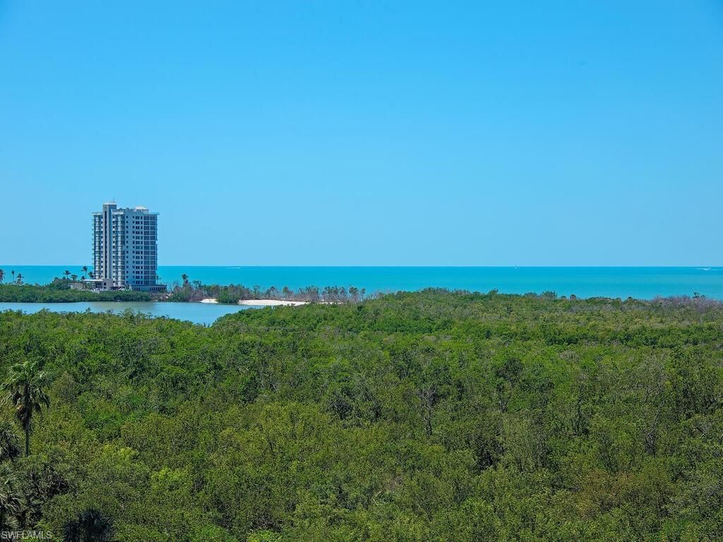 Photo of 6075 Pelican Bay BLVD #705, NAPLES, FL 34108 (MLS # 225038920)