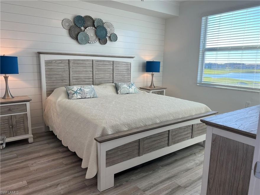 GOLF & INVESTMENT OPPORTUNITY!!! MUST-SEE! Welcome to 5807 Double Eagle Cir #4635, a 3RD-FLOOR ARBOR floor plan condo located in the GATED, GUARDED THE NATIONAL GOLF & COUNTRY CLUB AT AVE MARIA. This 2 BR/2 BA residence with 1,120 SQFT offers a BRIGHT, OPEN LAYOUT where you enter directly into the great room and your eye is immediately drawn to the sliding glass doors and the EXPANSIVE LAKE VIEW beyond. From this elevated vantage point, you also enjoy a distant VIEW OF THE ICONIC AVE MARIA CHURCH in the town center, adding a unique sense of place. The condo features WESTERN EXPOSURE, delivering BEAUTIFUL SUNSETS and EVER-CHANGING SKIES over ONE OF THE LARGEST LAKES in Ave Maria.

The home was THROUGHTFULLY UPGRADED for personal use, resulting in a COHESIVE COASTAL-INSPIRED DESIGN THROUGHOUT. Features include CROWN MOLDING, CHAIR RAIL in the kitchen and great room, a SHIPLAP ACCENT WALL in the primary bedroom, and a BOARD-AND-BATTEN FEATURE WALL in the guest bedroom. There is NO CARPET; instead, the bedrooms feature HIGH-END TEXTURED LVP FLOORING in the bedrooms, complemented by STRAIGHT-EDGE BASEBOARDS AND DOOR TRIM that reinforce the relaxed, beachy aesthetic. The entire interior was PAINTED IN A FRESH WHITE & COOL BLUE PALETTE, creating a LIGHT, AIRY ATMOSPHERE reminiscent of a vacation retreat.

The condo is offered FULLY TURNKEY and EXCEPTIONALLY WELL STOCKED, reflecting its original purpose as a private seasonal residence. In addition to QUALITY FURNISHINGS, the home includes thoughtful EXTRAS SUCH AS a DEHUMIDIFIER, ROBOT VACUUM, CORDLESS STICK VACUUM, ADDITIONAL TOWEL BARS, SHOWER CADDIES, SOFT NIGHT LIGHTS, and WELL-PLANNED STORAGE SOLUTIONS. The primary bedroom features a KING-SIZE BED, while the guest room includes a QUEEN-SIZE BED, along with a DESK & PRINTER. 4 CEILING FANS with remotes—located in both bedrooms, the living area, and the balcony—enhance comfort throughout.

The SCREENED-IN BALCONY, furnished with 2 RECLINERS AND A LOVESEAT two recliners and a loveseat, is an ideal place to unwind while taking in the lake, sunset, and distant town views. This property includes a GOLF MEMBERSHIP and provides FULL ACCESS TO THE NATIONAL'S RESORT-STYLE AMENITIES, including championship golf, a resort pool, fitness center, pickleball, tennis, bocce, on-site dining, and a full calendar of activities. The condo is CURRENTLY TENANT-OCCUPIED THROUGH OCTOBER 15, 2026, with both seasonal and off-season tenants in place.

This residence is best appreciated in person, where the views, light, and relaxed coastal atmosphere truly stand out— a MUST-SEE FOR THOSE SEEKING A COMPELLING INVESTMENT OPPORTUNITY NOW AND MAYBE A TURNKEY GOLF COMMUNITY HOME IN THE FUTURE.

The National is located within Ave Maria, a nationally recognized BLUE ZONE® COMMUNITY and ONE OF THE TOP MASTER-PLANNED COMMUNITIES IN THE US, offering a vibrant town center, events, parks, shopping, dining, and AVE MARIA UNIVERSITY.

Ave Maria: where community meets paradise.