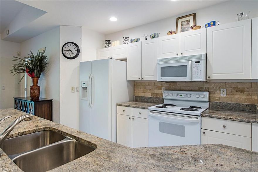 FANTASTIC OPPORTUNITY TO BE A HOMEOWNER IN ONE OF BONITA SPRINGS MOST DESIRABLE COMMUNITIES! Close to HWY 41, shopping, restaurants and the wonderful pristine white sand beaches of Southwest Florida. Carriage Homes at Wedgewood is a 24/7 gated community with private pool & cabana. Well maintained 3 bedrooms, 2 full bathrooms, living room, dining room, family room, in home laundry room and attached one car garage. Large open kitchen with granite counter tops. There is absolutely NO CARPET IN THIS HOME... tile and laminate flooring throughout. Big screened lanai right off living room and master bedroom. This home features a great room and split bedroom floor that creates two separate living areas. Great separation of space making this the perfect home for the entire family. Light, bright and full of natural light makes this home one to see. All living area is on the second floor which offers extreme privacy along with cathedral ceilings. This home is perfect as full time, part time or seasonal use. Easy living close to the beach with access to Bonita Springs and North Naples just a few miles away. Come see this wonderful home. You will not be disappointed.