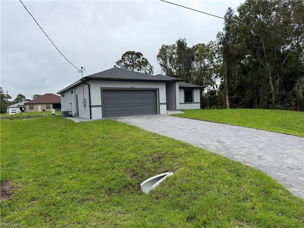 Photo of 900 Alaska AVE, LEHIGH ACRES, FL 33971 (MLS # 226014688)