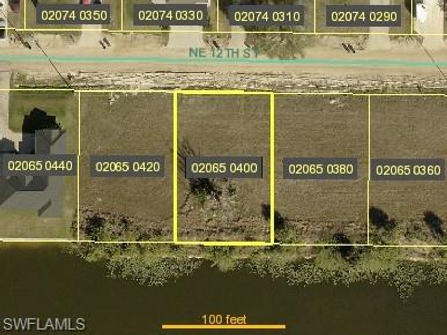 BEAUTIFUL WATERFRONT LOT CONNECTED TO CITY UTILITIES!   This extraordinary vacant lot offers a unique opportunity to build your dream home. Nestled in a tranquil setting, this property provides a blank canvas to create your own private oasis, With direct freshwater canal frontage.
Take advantage of this offering and enjoy the peace and quiet of the area, along with convenient access to local activities and waterways. Whether you are a builder, investor, or future homeowner, this parcel represents a smart investment in a promising, up-and-coming location