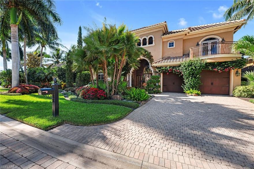 As you enter through the courtyard into your own private oasis, you are immediately drawn in by the expansive outdoor spaces and the rock-adorned spillover waterfall cascading into the lagoon-shaped pool that wraps along the home creating stunning views from both the inside and out. The adjacent outdoor living space is complete with a summer kitchen, fireplace and outdoor shower. This two-story villa is perfect for entertaining with three bedrooms and a den in the main house and two additional bedrooms located in the two-story cabana, a perfect space that offers exceptional privacy. Designed for endless luxurious living, the oversized living room with its soaring ceilings opens up through pocketing sliding doors to additional outdoor living that overlooks serene water views. A chef's kitchen with luxury appliances, custom wood beamed ceilings, an air-conditioned garage and a new roof in 2020 are only a few of the exceptional features of this home!  Located in the award-winning community of Mediterra with a commitment to excellence that has led to three Distinguished Emerald Club Awards.