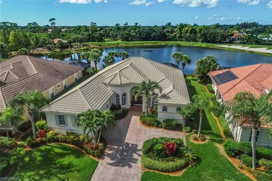 CROWN COLONY FURNISHED LUXURY HOME.  VIEW OF LAKE & GOLF COURSE. Grand entrance to a large great room, 4 bedrooms, 3 baths (1 pool access bath), formal dining, den, large kitchen, breakfast nook & large laundry room. Relax & rejuvenate on the huge travertine paver lanai with raised spa - spillover to a beautifully refinished pool all facing SW for sun. Sit above the blue lake & a well maintained 10th fairway of this respected golf course. High quality & well maintained appliances and AC, lots of upgrades including crown molding in every room, tile on diagonal, wood floors, alarm system (cameras, lighting, garage door and AC control), electric & accordion shutters, new exterior paint, built-in master closet, plantation window shutters, built-in great room entertainment center, kitchen granite counters, backsplash, pantry, desk, & more worth seeing & experiencing. Home is in excellent condition. Equity golf membership country club with restaurant, putting green, driving range & challenging golf course. Prime location near beaches & islands. Membership available but not mandatory. HOA includes tennis, fitness, pool and spa in this gated community.