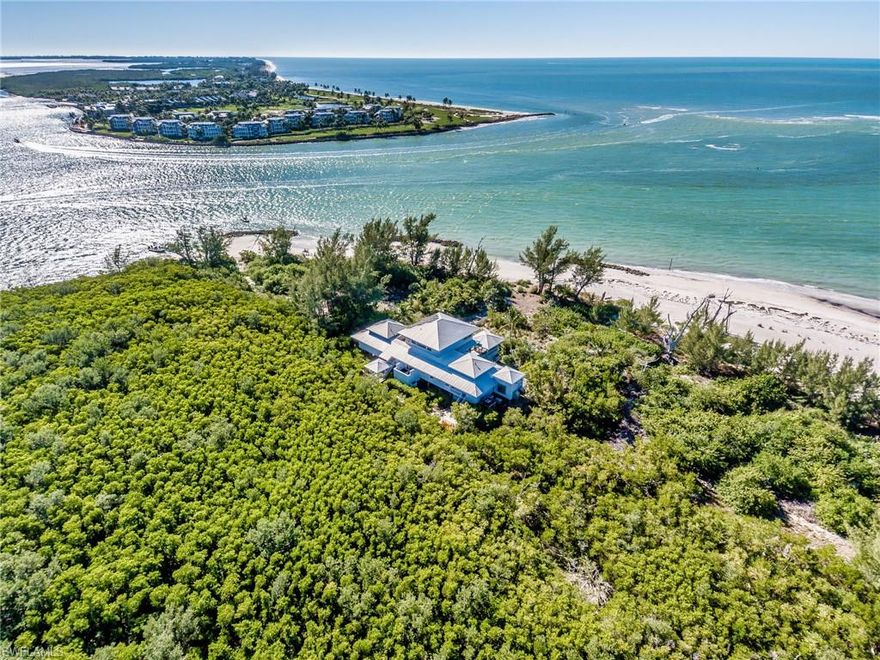 Gulf Front Coastal property surrounded by water on 3 sides and a State Preserve Protected on the 4th side. Enjoy Bali influenced architecture in this 3 story / 4 bedroom en-suites and 2 lofts. Home is situated on the largest Parcel on Upper Captiva at the corner of Red Fish Pass and across from South Seas Resort. Gas cooking, granite counter tops. 3 additional Guests en-suites (two with extra lofts and tubs). Access the Owner's Suite by way of a hand carved mahogany stairway featuring a separate sitting area, steam shower, private outdoor sun deck and outdoor shower overlooking the Gulf of Mexico for fabulous sunrises and sunsets. Enjoy covered and open decks on both upper and living levels plus a separate screened Gazebo for dining and relaxing. Features include top of the line Kohler fixtures, 5 outdoor showers, generously sized spa, pool with swim jets, in-home elevated lift, 19 Solar Panels, Generators/Invertors for electric, electric shutters, Sand volleyball court, Bayside dock with lift and fish cleaning station. Perfect for buyers with extended family and friends, group investment and corporate escapes. 6.57 acre Island Estate. SERIOUS AND REASONABLE OFFERS CONSIDERED.