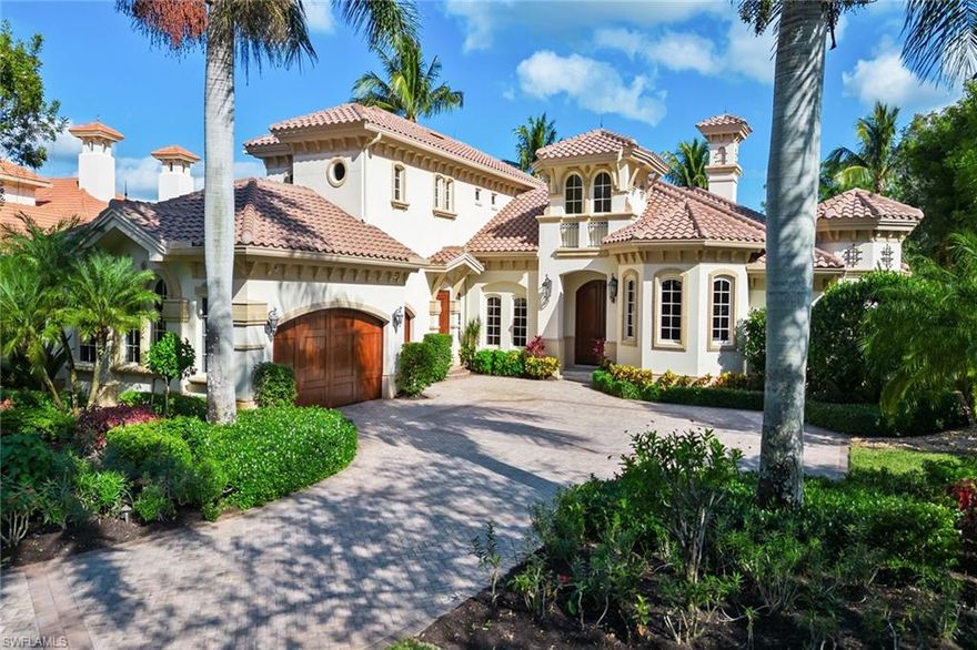 Luxury awaits in this turnkey 5-bedroom plus study, 5.5-bath home, in highly regarded Isla del Sol a gated community, within Fiddler's Creek’s gated community. A grand entrance leads to an impressive view of the pool, lake, and golf course. Tray ceilings with crown molding and lighting enhance the ambiance. The gourmet kitchen boasts natural gas cooking, granite, and high-end stainless appliances. Each bedroom has an en-suite bathroom and custom closet. The owner's suite features a jetted Jacuzzi tub, walk-in shower, dual water closets, bidet, makeup counter, dual sinks, and 2 custom walk-in closets. The .7+ acre homesite provides privacy and exceptional views, with an enormous screened-in lanai, saltwater lap pool with spa, and outdoor kitchen with Lynx gas grill offering endless entertainment options. Features in this quality Gulf Bay-built home include a 3-car garage, home automation, surround sound, 60 KW house generator, 2 tankless water heaters, ADT security system, lightning rods, stone and hardwood floors, upgraded millwork, central vacuum, Lutron lighting system, impact doors and windows, and solid wood core doors.