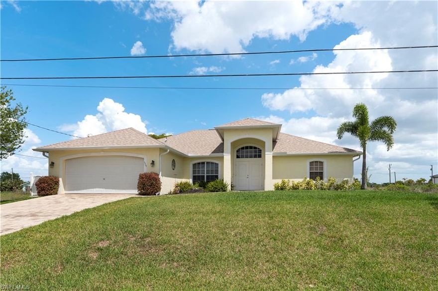 Single-family residence built in 2005, offering 3 bedrooms and 2 bathrooms with approximately 1,733 sq ft of living area. The home features a functional layout with defined living and dining areas, as well as a kitchen equipped with refrigerator, microwave, and range.

Interior finishes include carpet and tile flooring, with central electric heating and natural gas available. The property includes a 2-car attached garage and additional storage space, providing practical solutions for organization.

Exterior features include patio space and direct proximity to a canal, offering added privacy and a distinctive setting. Located in a non-gated community with convenient access to local roads, schools, and everyday amenities within Cape Coral.