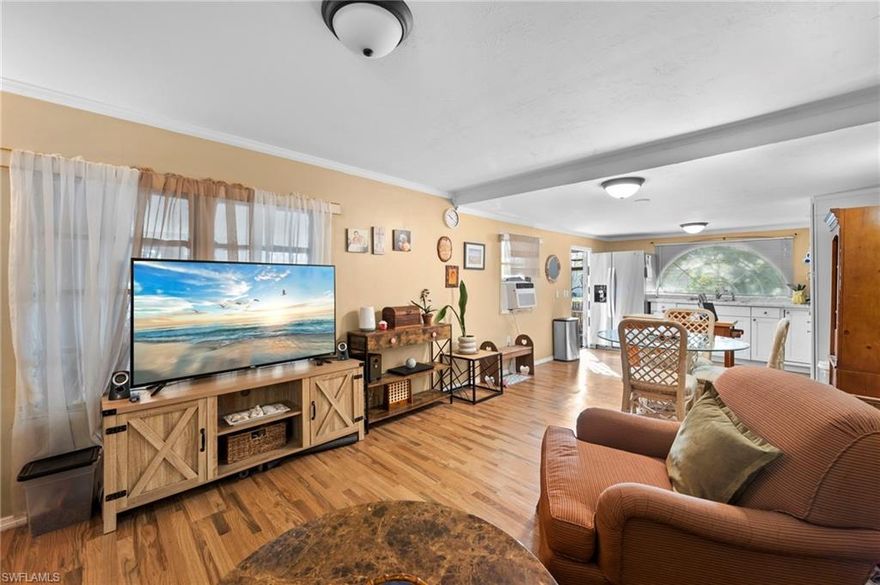 Welcome to Henderson Creek Park, a true hidden gem where the charm of yesteryear meets a warm, close-knit community and timeless connections. This spacious 2-bedroom, 2-bath residence has been lovingly maintained and thoughtfully cared for, offering comfortable living with a sense of ease and simplicity. Enjoy the beauty of mature fruit trees right on your property, along with the convenience of a generous storage room and dedicated laundry room, features that add everyday practicality to this inviting home. Henderson Creek Park offers a voluntary HOA and an impressive array of amenities, including a heated pool and spa, shuffleboard courts, and boat launch with dockage, plus optional boat storage for those who love life on the water. A full calendar of social events fosters a friendly, engaging atmosphere where neighbors become friends. If you’re seeking a relaxed Naples lifestyle with classic character, waterfront access, and a genuine sense of community, this is an opportunity you won’t want to miss.