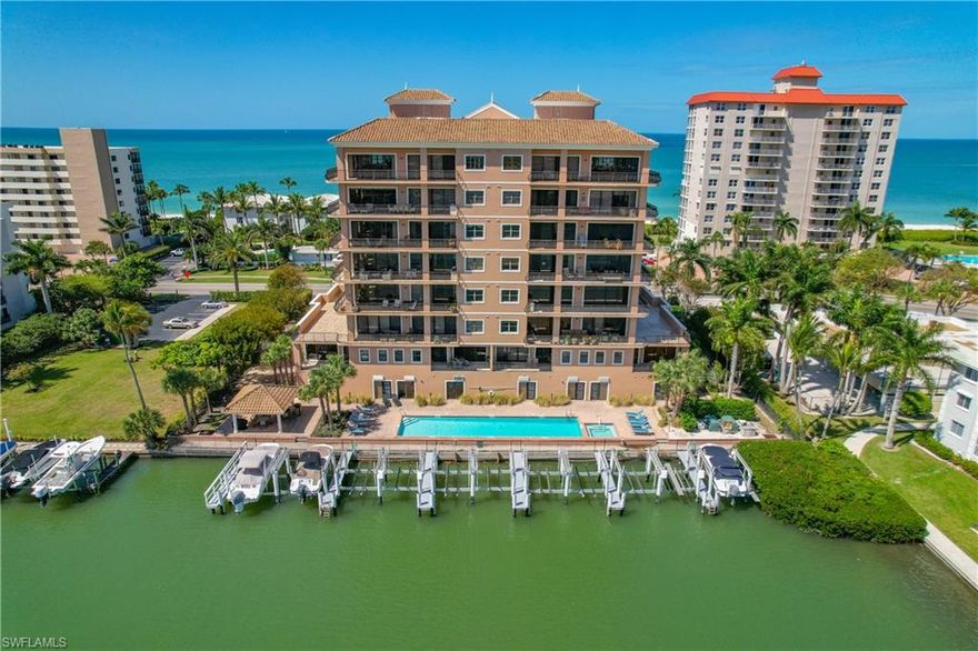 Boat and beach! Have it all with this stunning, spacious & airy, open floor plan waterfront condo in Vanderbilt Beach.  Expansive, panoramic water views everywhere - east over the bay and canals, west over the blue green gulf. Plenty of outside space with balconies on both sides. This 3250 SF, updated 5th floor end unit has 3 Bedrooms plus office/den, laundry room, Dining room (with convertible pool table!), Living room, and elevator opening directly into a private entry foyer. Large Master BR has 2 walk-in closets and water views with sliders out to balcony. 2 additional guest rooms with ensuite baths and water views. Professionally decorated and furnished. Your own PRIVATE DOCK with BOAT LIFT.  Plus, a CABANA with full bathroom, mini fridge, sink, TV, and pull-out sofa! Beach access directly across the street. The Grand Bellagio boasts a waterfront pool, exercise room, community room, and guest suite. 2 assigned parking spots -1 covered in garage, 1 uncovered inside the gates. Spectacular offering all around!
