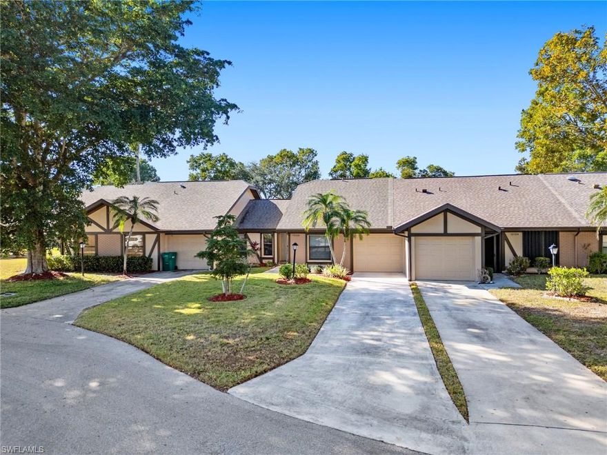 Nestled in the heart of South Fort Myers is the charming community of Compass Pointe. Streets with canopy lined oak trees and mature landscaping lead you to this amazing 2 bedroom, 2 bath attached villa. As you enter the home, volume ceilings and abundant natural light create a peaceful feel. Tile flows throughout the entire home, adding both style and easy maintenance. The kitchen is the centerpiece and main attraction of the home. A large center island with quartz countertops is a place where family will often gather. The designer backsplash, vent hood, and wood shelving add a modern touch that blends seamlessly with the open layout. You'll appreciate the great use of space, with an additional desk work area conveniently located adjacent to the kitchen. Designer California Closets throughout the home add organization and ideal storage space, making every area functional and clutter-free. Step outside to the large, expansive lanai—a perfect spot to relax and enjoy some quiet tranquility. Recent upgrades include newer appliances, AC, and H2O water heater (all 2022), and a roof installed in 2016. For added peace of mind, manual shutters provide hurricane protection and comfort. Compass Pointe is just minutes away from pristine sandy white beaches, great entertainment and dining, plus world-class shopping. This villa offers a blend of comfort, style, and convenience—welcoming you to your new home!