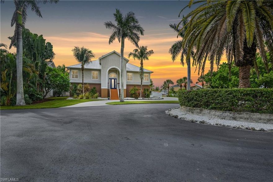 BOATERS DREAM! This unique custom built 2-story home is perfect for those who love to spend time on the gorgeous waterways of SWFL. Located in the small gated neighborhood of Palm Isles just before heading onto Estero Island-one of the best kept secrets in Fort Myers! A beautiful palm tree lined road leads the way to this home offering over 2,400sf of living area that is situated right on a cul-de-sac-low traffic & very private setting. This home is a boater enthusiast's dream w/ 170ft of water frontage and featuring a wood boat dock w/ two boat lifts (water/electric available at dock)... plus the Gulf of Mexico is just a short boat ride away. Volume ceilings, almost wall-to-wall 10ft sliders on the back wall of the second floor, cupola in great room, bamboo flooring, open kitchen w/ a gourmet design (cooktop & double wall oven), huge bonus room w/ bar on first floor, and impact windows/doors are just some of the bells & whistles this home has to offer. You will love spending time relaxing or entertaining on the open rear lanai that offers a heated pool/spa, long under truss area, and brick pavers on pool deck. Fantastic location, just minutes from Fort Myers Beach & Sanibel!