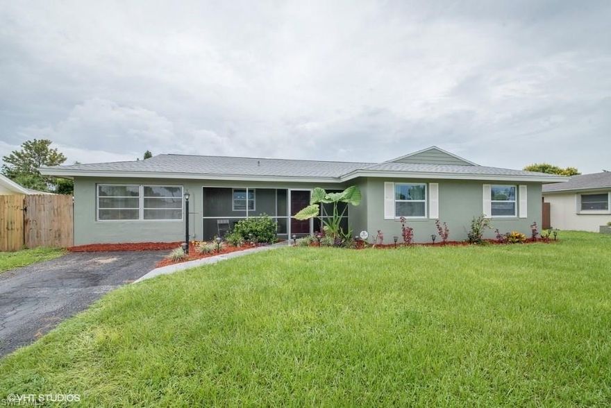 Adorable Move-In-Ready with 3 bedrooms, 3 full baths * Converted garage could be used as a den, extra bedroom, or "man" cave with private entrance, closet with shelving, and full bath * spacious FENCED back yard with newer SHED * NEWER ROOF in 2013 is EPA energy efficient certified, with transferable 25 YR. warranty * NEWER WINDOWS * Low maintenance and durable Terrazzo floors throughout * Stainless Steel Appliances, raised panel cabinets, recessed lighting and lots of counter space in kitchen * NEWER WASHER & DRYER included * Freshly painted interior with Spa like colors throughout * LED Lighting throughout * Fans with wireless remotes * Updated Bathrooms * Lots of closet space * Screened front & back porch * NO HOA DUES! Call today for your private showing!