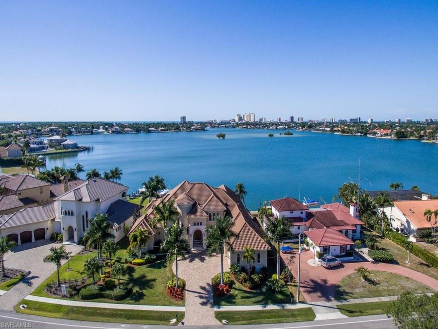 This exquisite home in the estates of Marco Island offers nearly 5,400 square feet of pure luxury! Phenomenal breathtaking views of Roberts Bay, the Marco skyline and evening sunsets from this southwest facing two-story custom built home by RK Reiman. Sold furnished, every detail in this home is spectacular with extensive wood working throughout. The home offers 4 bedrooms, 4 fulls baths and 3 half baths. Enjoy the outdoor kitchen with grill and double refrigerator, along with the heated pool and spa and large open lanai area overlooking the Bay. The property also has a long paver driveway and extra large 3 car garage. This is a must see for the most discriminating buyer!