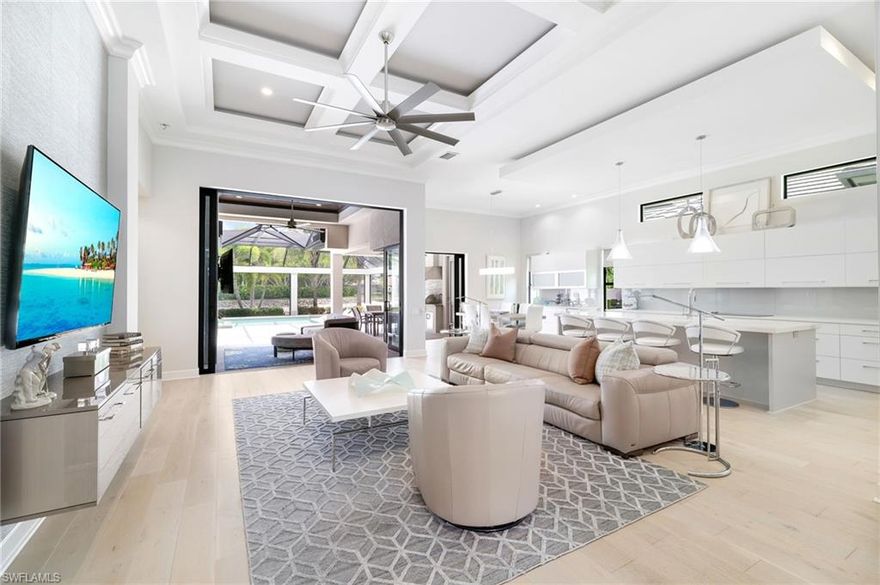 Welcome to this stunning modern residence nestled in an exclusive gated community of Miromar Lakes Beach and Golf Club, where elegance meets comfort. This meticulously designed home boasts of warm hardwood floors seamlessly throughout with open concept living spaces, creating a cozy yet contemporary atmosphere. This gourmet kitchen is a chef's dream, featuring top-of-the line appliances, sleek cabinetry, and large island perfect for entertaining. The spacious primary suite offers a private retreat with views of the water and a spa-inspired ensuite bathroom and generous walk-in closet space. Additional bedrooms are well appointed and ideal for guests or a growing family. Step outside to your own private oasis an expansive lanai perfect for relaxing or entertaining. With 24/7 security, lush landscaping and exclusive access to neighborhood amenities, this home offers the perfect blend of privacy, luxury, and convenience. Miromar features 700 acres of fresh-water lakes, with boating, fishing, swimming, water skiing, 3 miles of sand beaches, Caribbean style beach grill, club house, pool, full-service spa, fitness center, golf, tennis and many other luxurious amenities.